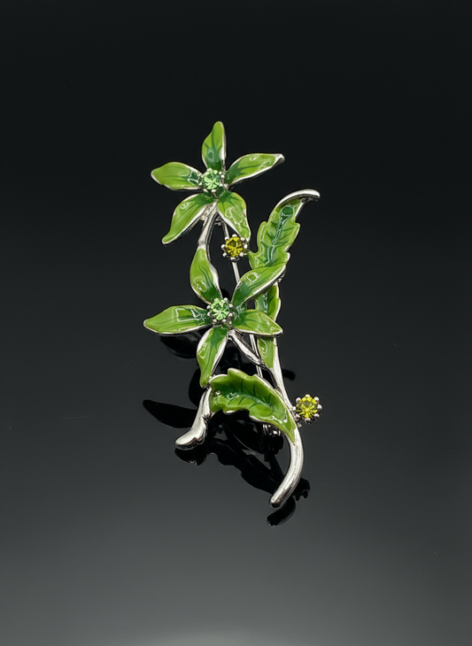 Broche de metal y strass con forma de flores