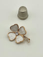 Broche de metal dorado con forma de flor