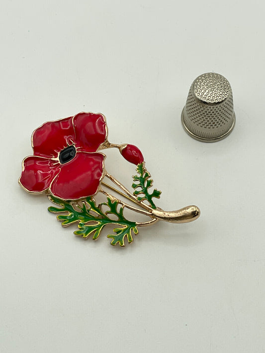 Broche de metal dorado y esmalte con forma de amapola