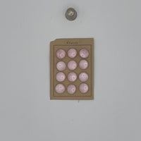 Cartoncillo de 12 botones vintage de pasta color rosa, años 50