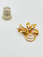 Broche vintage de metal y strass con forma de flor
