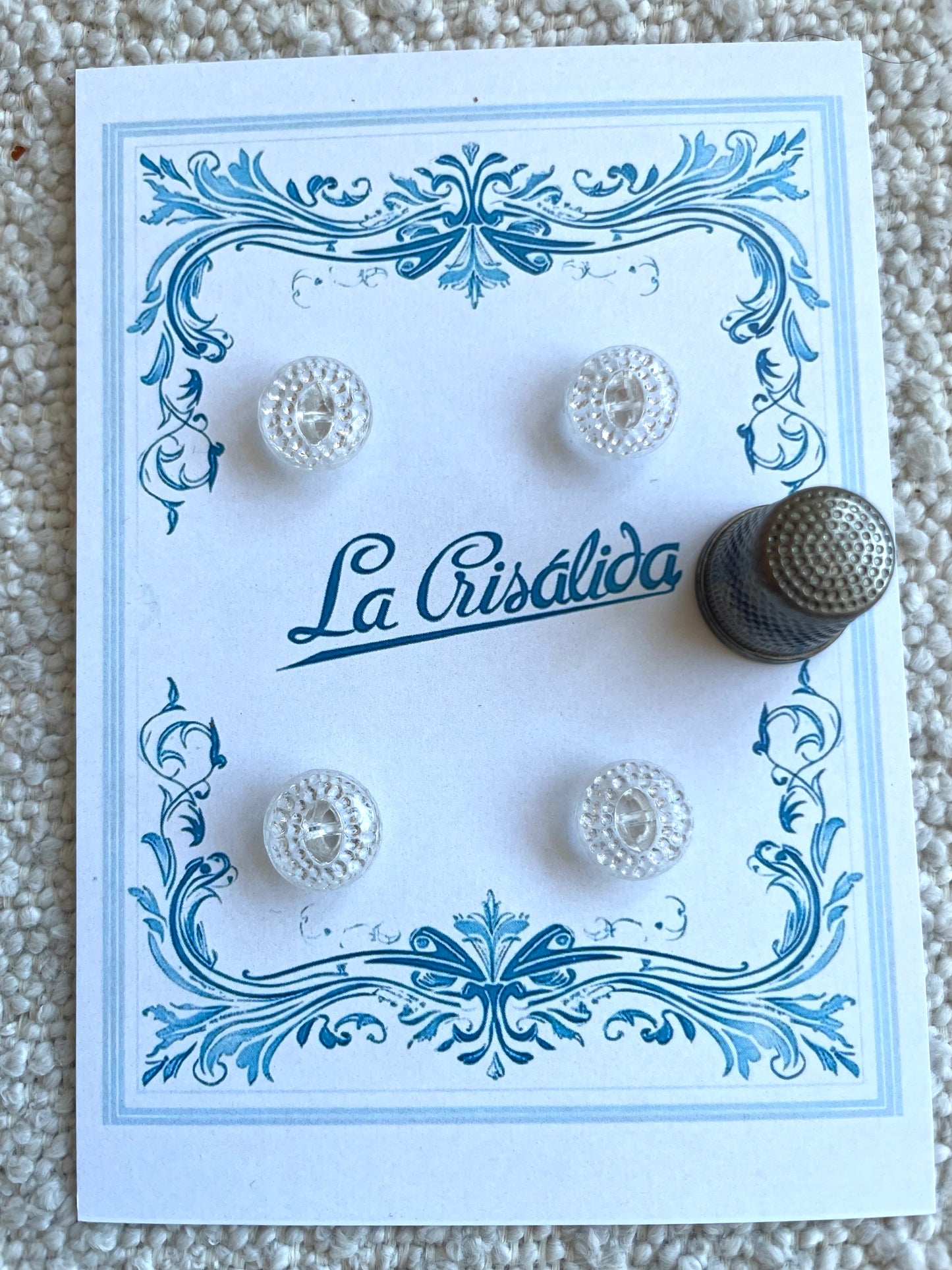 Cartón con 4 botones de vidrio, años 40, transparentes