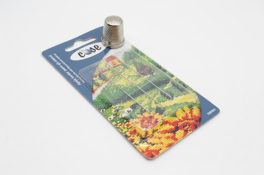 Aguja de bordar con ojo central COSE