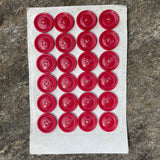 Cartón de botones antiguos color rojo